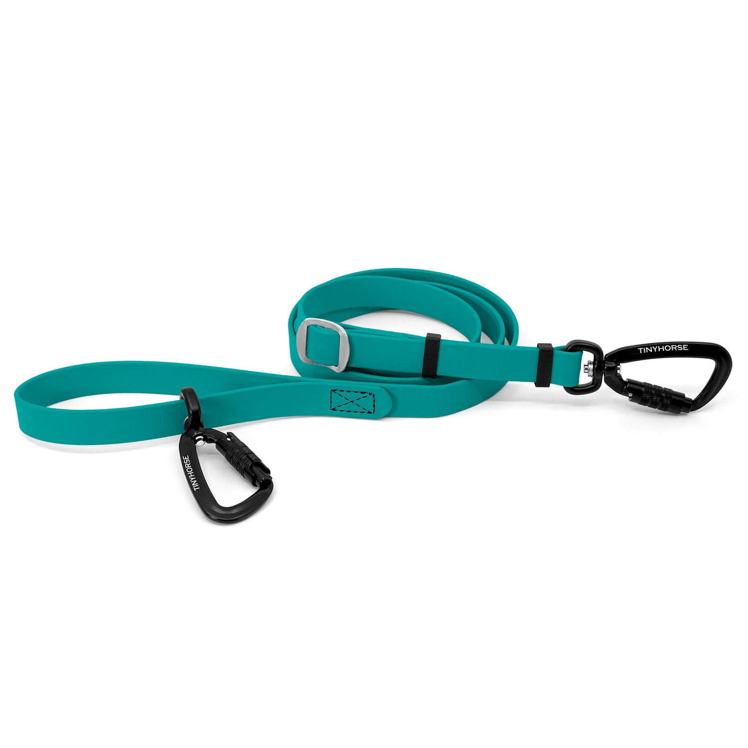 A teal, biothane dog leash coiled in a circle, featuring a black auto-locking carabiner with TINYHORSE laser-engraved in white on either end, and a steel adjustable slide.