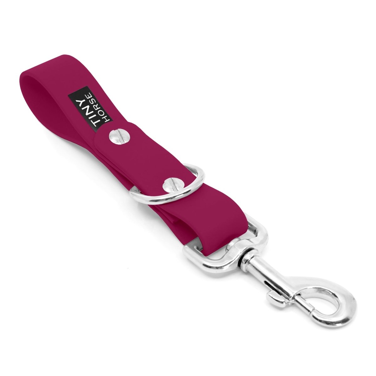 Short BioThane strap that slides onto a belt. Use this to walk dogs hands free by clipping their at the end of the strap. There is also a dee ring for attach extra accessories. Colour is magenta.