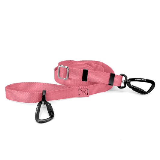 A baby pink-coloured Lead-All Lite Extra with 2 auto-locking carabiners and nylon webbing